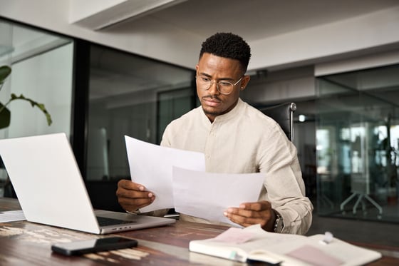 Businessman reading legal paperwork