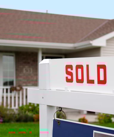 home with a sold sign out front