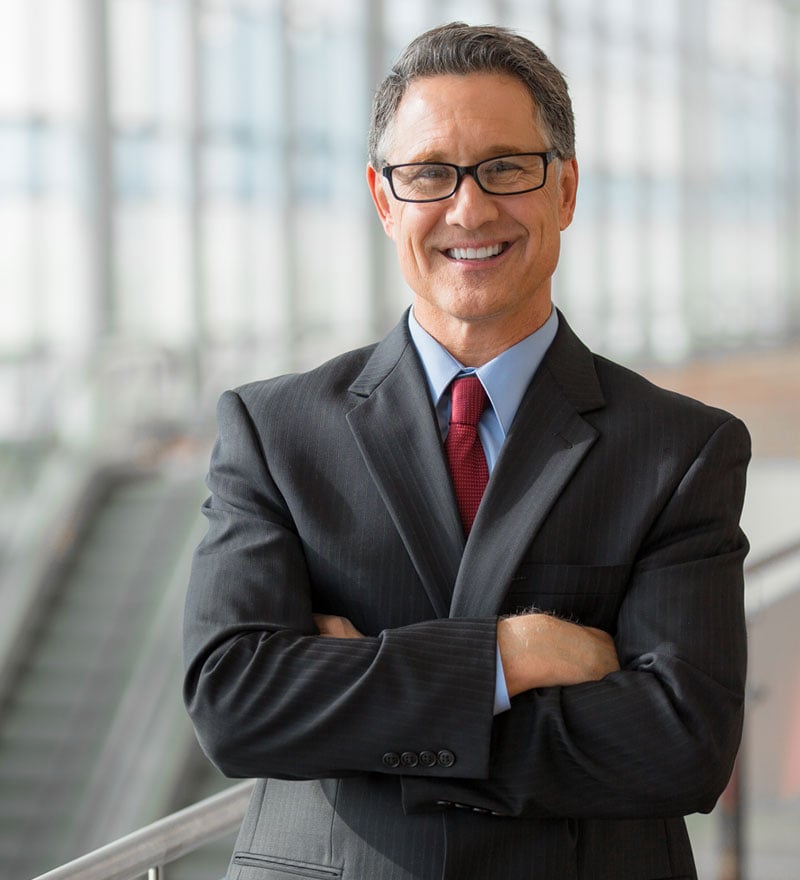businessman standing smiling
